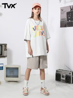 Cotton T-shirt with candy-colored monogram print and patchwork cuff hem