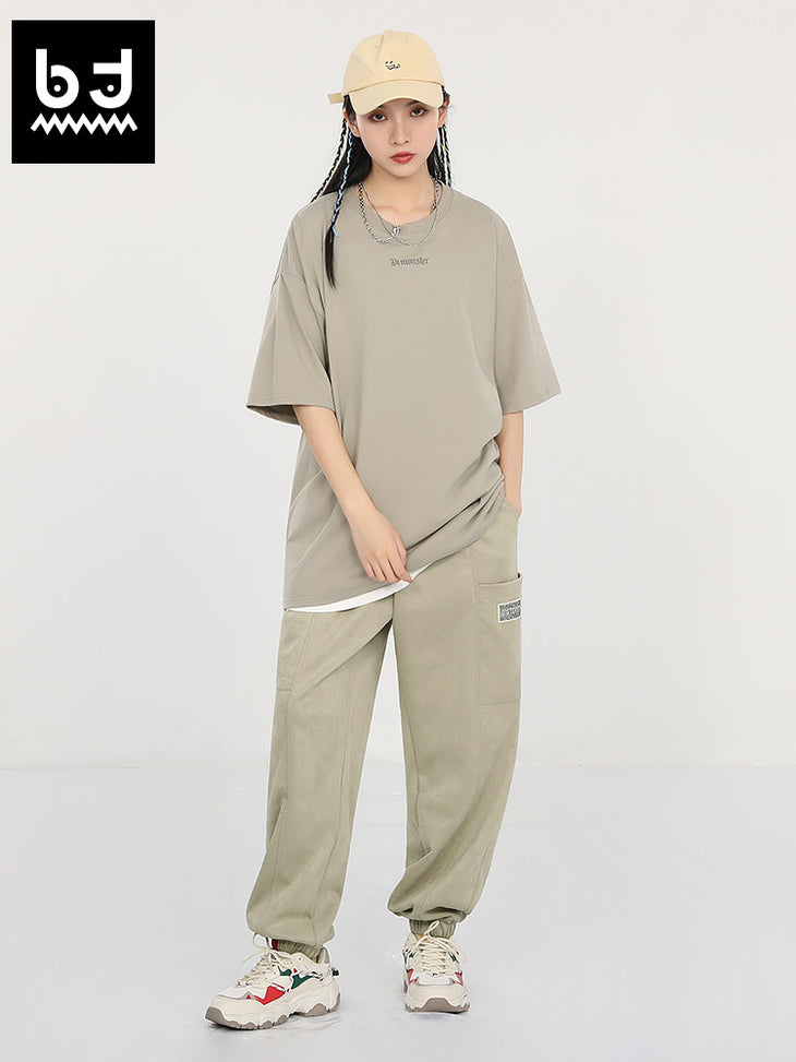 Cargo style solid color multi-pocket drawstring waistband suede bunched feet casual pants